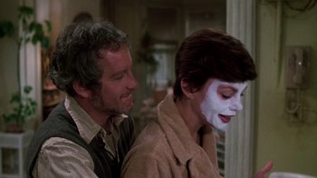 Movie still from “The Goodbye Girl” (1977), directed by Herbert Ross – A man and a woman with a face mask on; Close Up shot, Over the shoulder angle