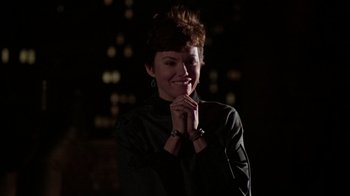 Movie still from “The Goodbye Girl” (1977), directed by Herbert Ross – A woman in a black shirt is posing for a picture; Close Up shot, Over the shoulder angle