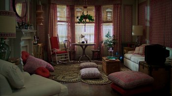 Movie still from “The Goodbye Girl” (1977), directed by Herbert Ross – A living room filled with lots of furniture and windows; Wide shot, High angle