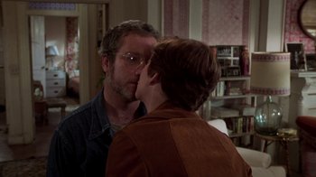 Movie still from “The Goodbye Girl” (1977), directed by Herbert Ross – A man and a woman kissing in front of a bathroom mirror; Close Up shot, Over the shoulder angle
