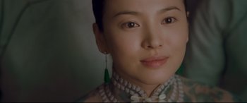 Movie still from “The Grandmaster” (2013), directed by Kar-Wai Wong – A person wearing a dress; Close Up shot, Low angle