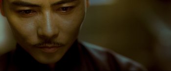 Movie still from “The Grandmaster” (2013), directed by Kar-Wai Wong – A man's face with a mustache; Extreme Close Up shot, High angle