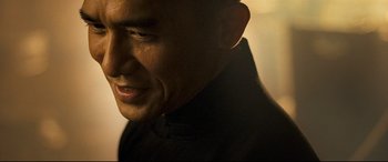 Movie still from “The Grandmaster” (2013), directed by Kar-Wai Wong – A man's face in the light; Close Up shot, Low angle