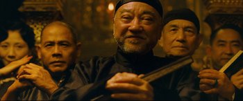 Movie still from “The Grandmaster” (2013), directed by Kar-Wai Wong – A group of men standing next to each other; Close Up shot, Low angle