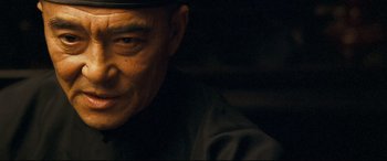 Movie still from “The Grandmaster” (2013), directed by Kar-Wai Wong – A person wearing a hat; Close Up shot, Low angle