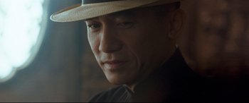 Movie still from “The Grandmaster” (2013), directed by Kar-Wai Wong – A person wearing a hat; Close Up shot, Low angle