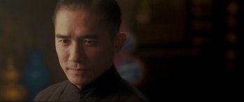 Movie still from “The Grandmaster” (2013), directed by Kar-Wai Wong – A person wearing a black shirt; Close Up shot, Low angle