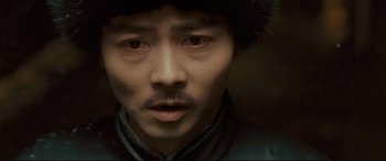 Movie still from “The Grandmaster” (2013), directed by Kar-Wai Wong – A person wearing a hat; Close Up shot, High angle