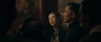 Movie still from “The Grandmaster” (2013), directed by Kar-Wai Wong – A man and a woman standing next to each other; Medium shot, Over the shoulder angle