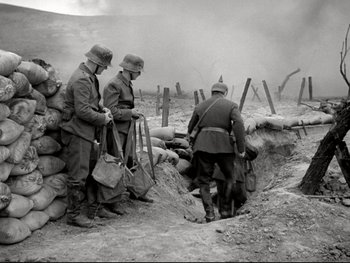 Movie still from “The Great Dictator” (1940), directed by Charles Chaplin – A group of men standing next to each other in a field; Wide shot, High angle