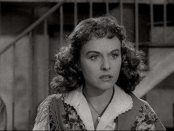 Movie still from “The Great Dictator” (1940), directed by Charles Chaplin – A black and white photo of a woman with curly hair; Close Up shot, Over the shoulder angle
