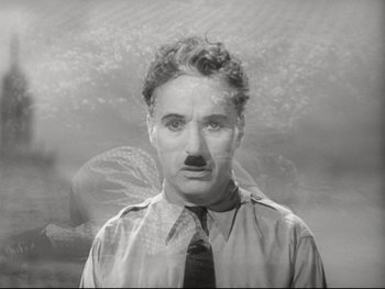 Movie still from “The Great Dictator” (1940), directed by Charles Chaplin – A man with a mustache wearing a neck tie; Close Up shot, Low angle