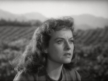 Movie still from “The Great Dictator” (1940), directed by Charles Chaplin – A black - and - white photo of a woman in a field; Close Up shot, High angle