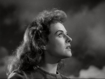 Movie still from “The Great Dictator” (1940), directed by Charles Chaplin – An old photo of a woman looking to the side; Close Up shot, Low angle