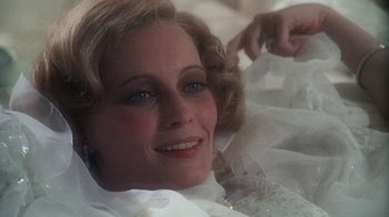 Movie still from “The Great Gatsby” (1974), directed by Jack Clayton – A woman's face in a white dress; Close Up shot, Low angle