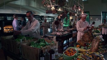 Movie still from “The Great Gatsby” (1974), directed by Jack Clayton – A group of chefs preparing food in a kitchen; Wide shot, High angle