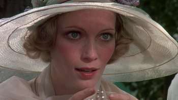 Movie still from “The Great Gatsby” (1974), directed by Jack Clayton – A person wearing a hat; Close Up shot, High angle