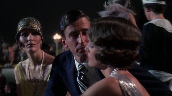 Movie still from “The Great Gatsby” (1974), directed by Jack Clayton – A man and a woman are talking to each other; Close Up shot, Over the shoulder angle