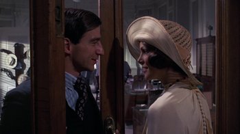 Movie still from “The Great Gatsby” (1974), directed by Jack Clayton – A man and a woman talking to each other; Medium shot, Over the shoulder angle