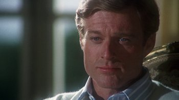 Movie still from “The Great Gatsby” (1974), directed by Jack Clayton – A person wearing a shirt and tie; Close Up shot, Over the shoulder angle
