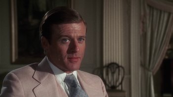 Movie still from “The Great Gatsby” (1974), directed by Jack Clayton – A person wearing a suit and a tie; Close Up shot, Over the shoulder angle