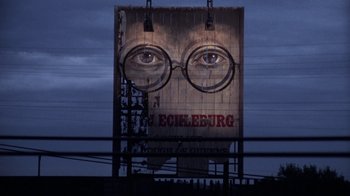 Movie still from “The Great Gatsby” (1974), directed by Jack Clayton – A large billboard with a picture of a man's eyes; Extreme Close Up shot, Low angle