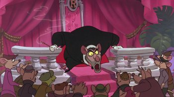 Movie still from “The Great Mouse Detective” (1986), directed by David Michener – A rat wearing a black robe in front of a group of people; Wide shot, Low angle