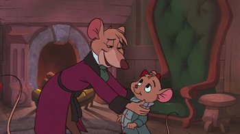 Movie still from “The Great Mouse Detective” (1986), directed by David Michener – A cartoon of a mouse holding a baby mouse; Medium shot, Over the shoulder angle