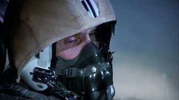 Movie still from “The Great Santini” (1979), directed by Lewis John Carlino – A man wearing a helmet and a gas mask; Close Up shot, Low angle