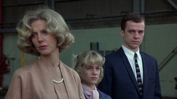 Movie still from “The Great Santini” (1979), directed by Lewis John Carlino – A woman and two young men standing next to each other; Close Up shot, Low angle