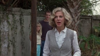 Movie still from “The Great Santini” (1979), directed by Lewis John Carlino – A woman standing next to a man and a girl; Medium shot, Over the shoulder angle