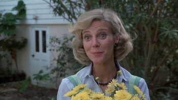 Movie still from “The Great Santini” (1979), directed by Lewis John Carlino – A person holding a bunch of flowers; Close Up shot, Low angle