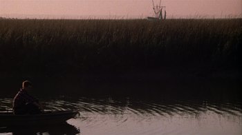 Movie still from “The Great Santini” (1979), directed by Lewis John Carlino – A small boat in the middle of a marsh; Extreme Wide shot, High angle