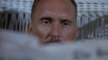 Movie still from “The Great Santini” (1979), directed by Lewis John Carlino – A man's face with a beard; Extreme Close Up shot, Low angle