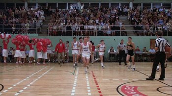 Movie still from “The Great Santini” (1979), directed by Lewis John Carlino – A group of young men playing a game of basketball; Wide shot, High angle