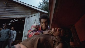 Movie still from “The Great Santini” (1979), directed by Lewis John Carlino – A man holding on to another man who is holding on to another man's chest; Medium shot, Low angle