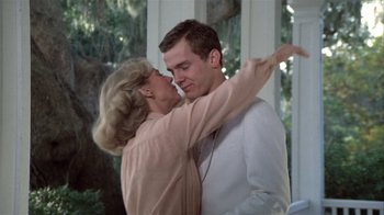 Movie still from “The Great Santini” (1979), directed by Lewis John Carlino – A man and a woman are dancing together; Medium shot, Low angle