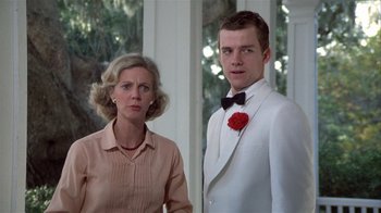 Movie still from “The Great Santini” (1979), directed by Lewis John Carlino – A man and a woman standing next to each other; Close Up shot, Low angle