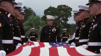 Movie still from “The Great Santini” (1979), directed by Lewis John Carlino – A group of men in uniform standing next to an american flag; Wide shot, Low angle