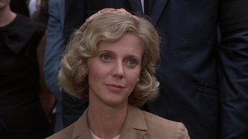 Movie still from “The Great Santini” (1979), directed by Lewis John Carlino – A person wearing a suit and tie; Close Up shot, Over the shoulder angle