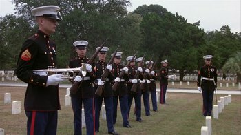 Movie still from “The Great Santini” (1979), directed by Lewis John Carlino – A group of men in uniform standing next to each other holding guns; Wide shot, Low angle