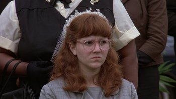 Movie still from “The Great Santini” (1979), directed by Lewis John Carlino – A woman wearing glasses and a red wig; Close Up shot, High angle
