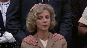 Movie still from “The Great Santini” (1979), directed by Lewis John Carlino – A woman with her arms around a man's shoulder; Close Up shot, Low angle