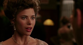 Movie still from “The Greatest Game Ever Played” (2005), directed by Bill Paxton – A person wearing a necklace; Close Up shot, Over the shoulder angle