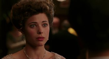 Movie still from “The Greatest Game Ever Played” (2005), directed by Bill Paxton – A person wearing a dress; Close Up shot, Over the shoulder angle