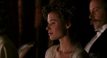 Movie still from “The Greatest Game Ever Played” (2005), directed by Bill Paxton – A beautiful woman wearing a white shirt and a necklace; Close Up shot, Over the shoulder angle