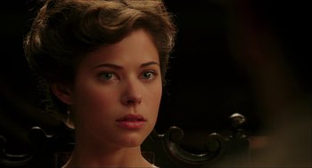 Movie still from “The Greatest Game Ever Played” (2005), directed by Bill Paxton – A woman's face in front of a mirror; Close Up shot, Over the shoulder angle