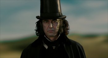 Movie still from “The Greatest Game Ever Played” (2005), directed by Bill Paxton – A person wearing a top hat; Close Up shot, Low angle