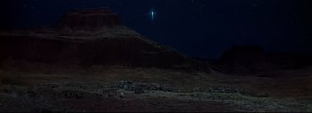 Movie still from “The Greatest Story Ever Told” (1965), directed by David Lean – A star shines in the night sky over a mountain; Extreme Wide shot, Low angle