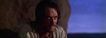 Movie still from “The Greatest Story Ever Told” (1965), directed by David Lean – A person wearing a robe; Close Up shot, Over the shoulder angle